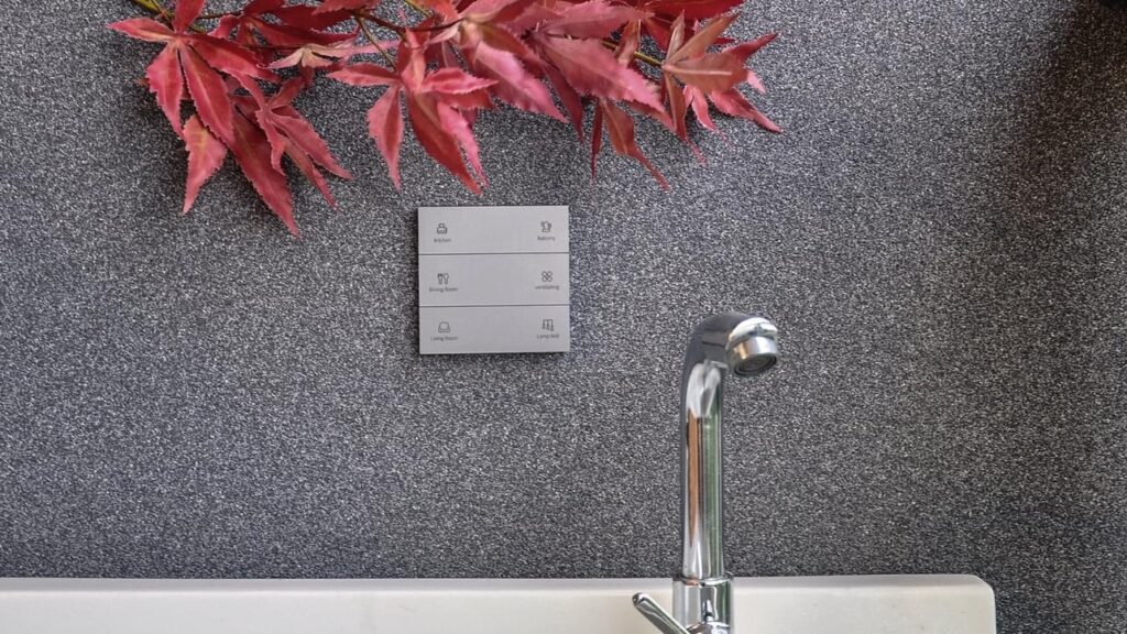 Dimi waterproof wireless switch with engraving installed in the bathroom wall next to the water sink